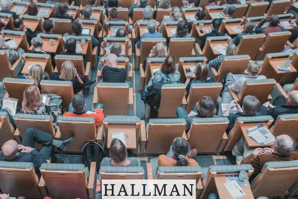 high-angle photography of group of people sitting at chairs