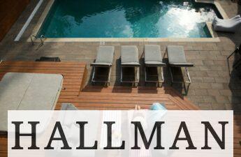 four gray loungers near pool