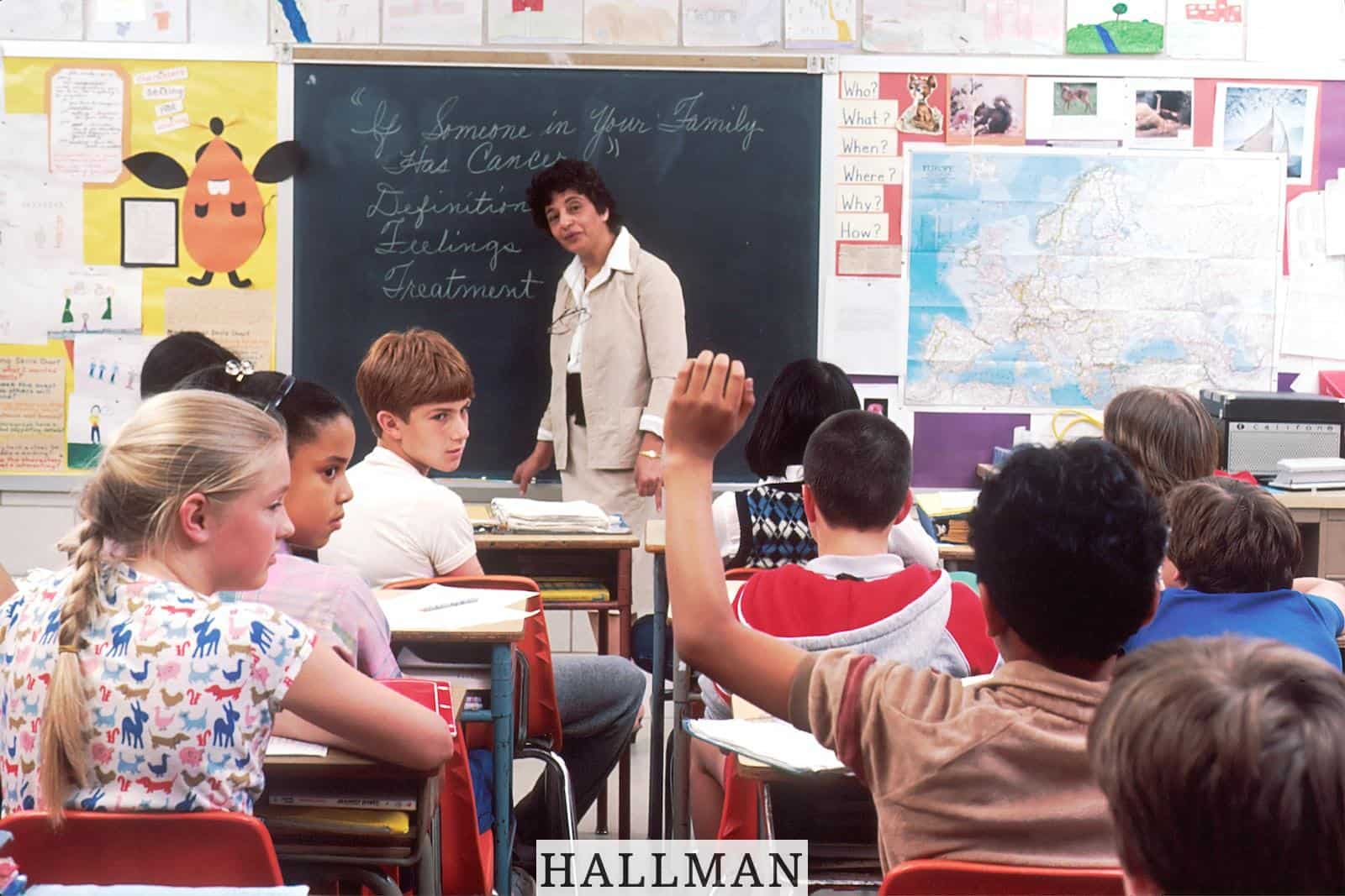 woman standing in front of children