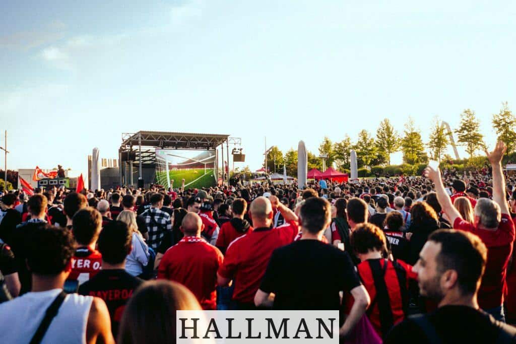 A large group of people standing in front of a stage